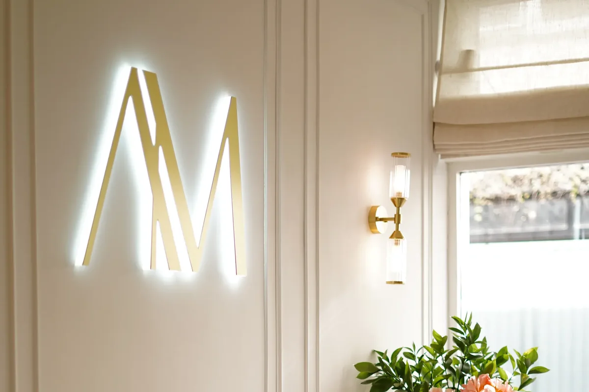 The gold AM monogram at the Aesthetic by Maria clinic in Kensington, London